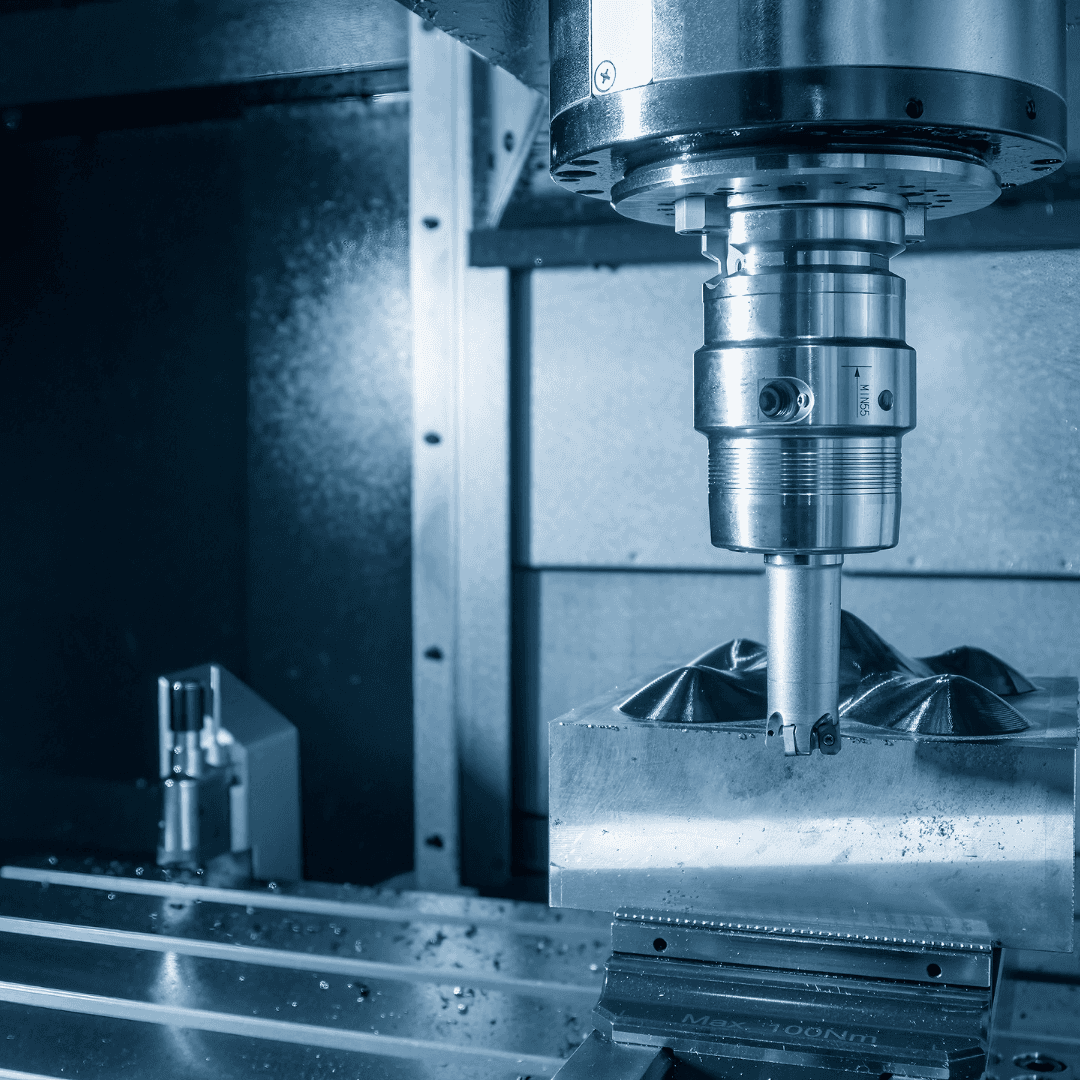 CNC machining in progress on a steel mold cavity