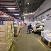 Production line and worker handling logistics at B-Pen Plastic factory